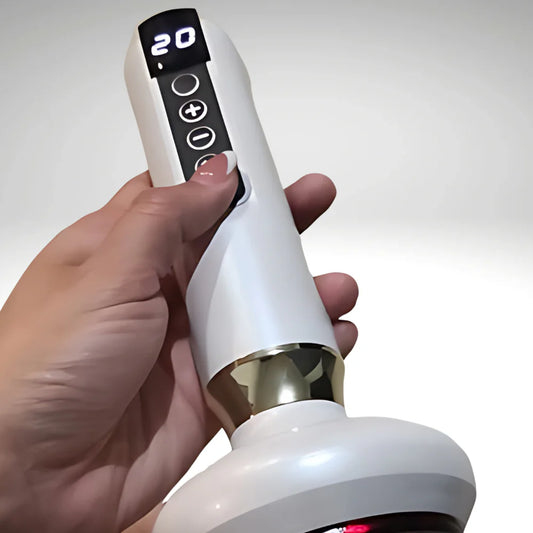 Hand holding a white electronic device with digital display and control buttons on a light gray background