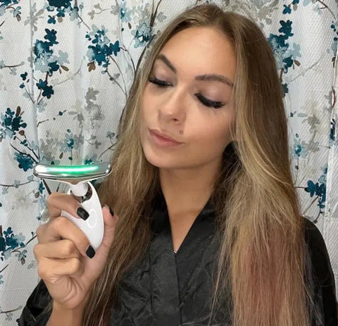 Woman holding the FaceWave Sculpting Tool