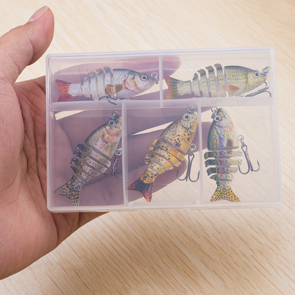 Transparent plastic case with fishing lures on a wooden surface