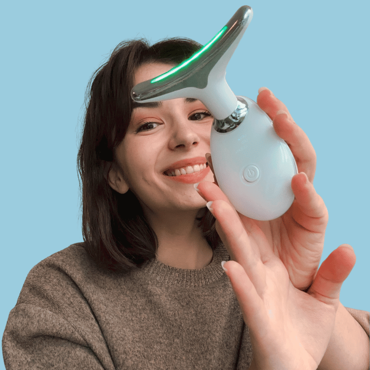 Woman holding the FaceWave Sculpting Tool 2